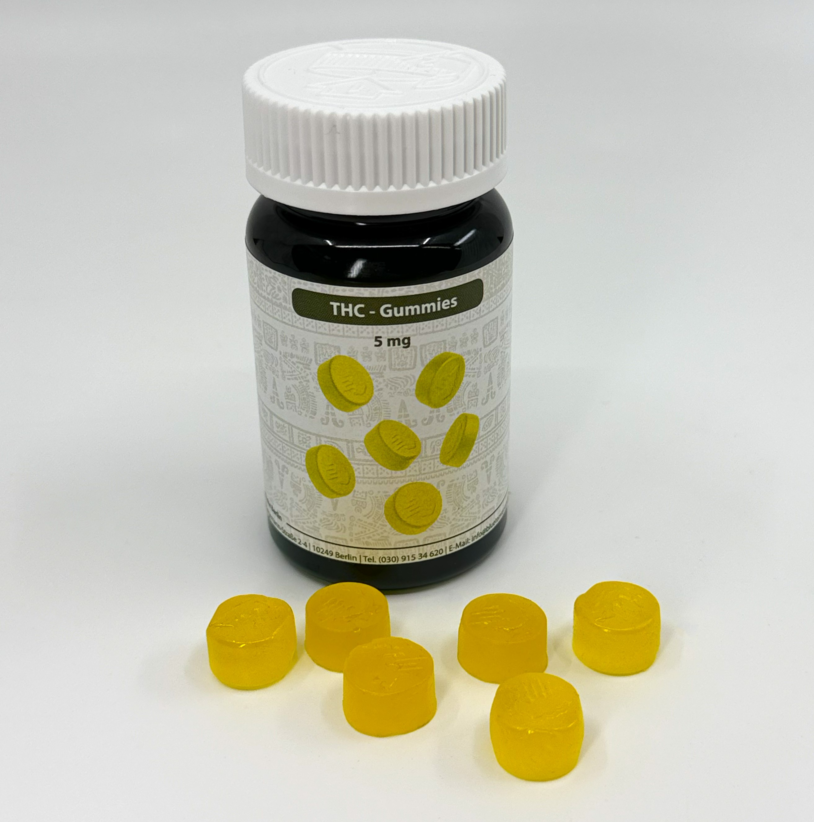 Bluetenversand.de THC Gummies Dose mit gelben 5mg THC Gummies davor liegend frontal